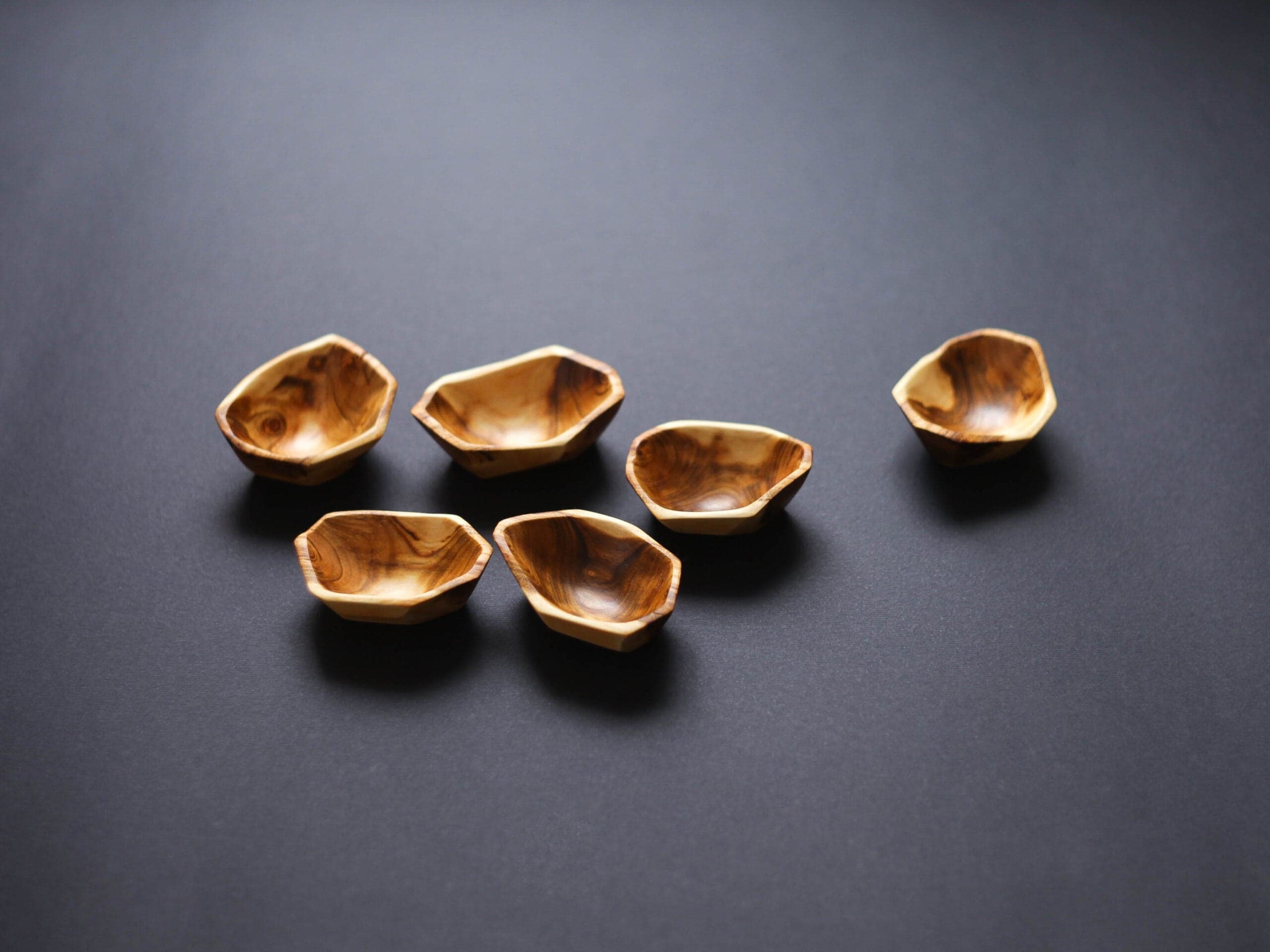 Handmade, artisan mini wooden apricot bowls for appetizers, spices, and sauces at your next dinner party.
