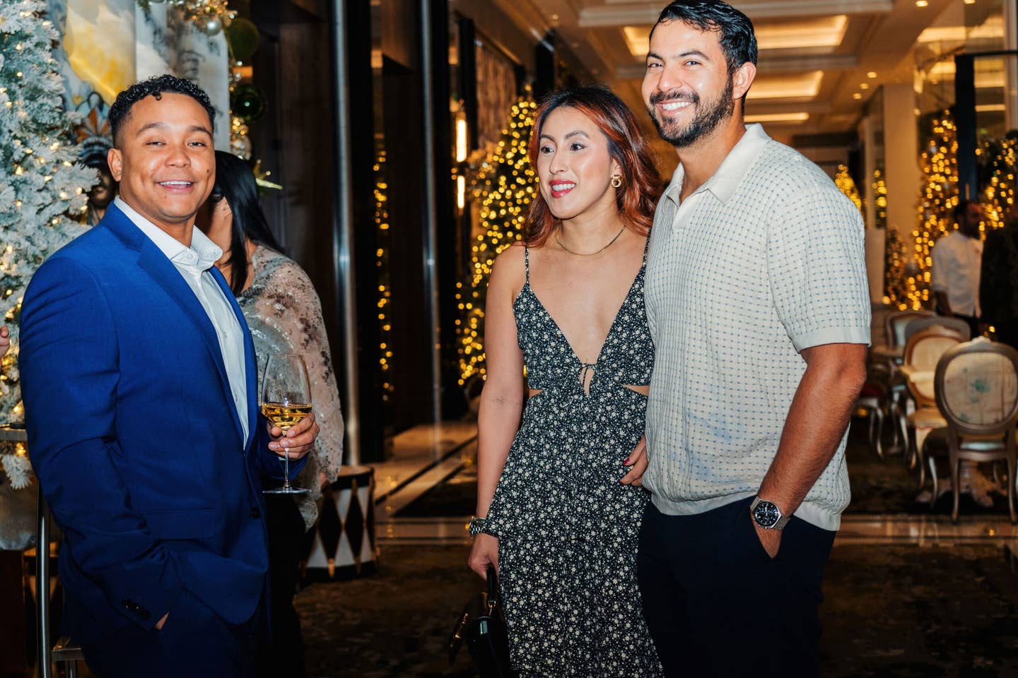 Ray Fontenot, Valerie Vuong, and Sebastian De La Rosa at a cocktail party.