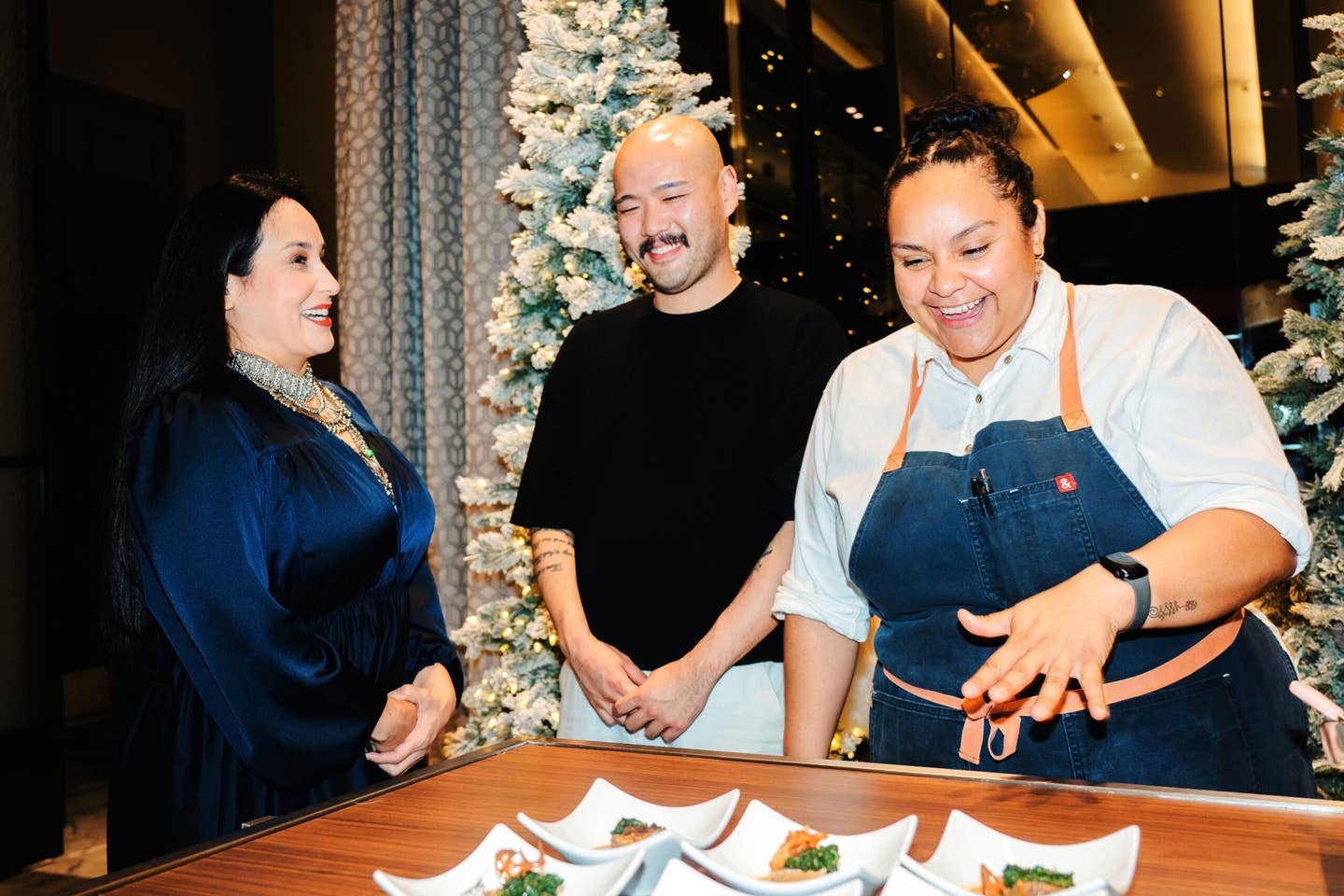 Alba Huerta shares a laugh with Henry Lu and Evelyn Garcia.