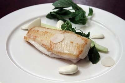 Sea bass with red chicory and lemon creme fraiche at Le Chateaubriand Paris