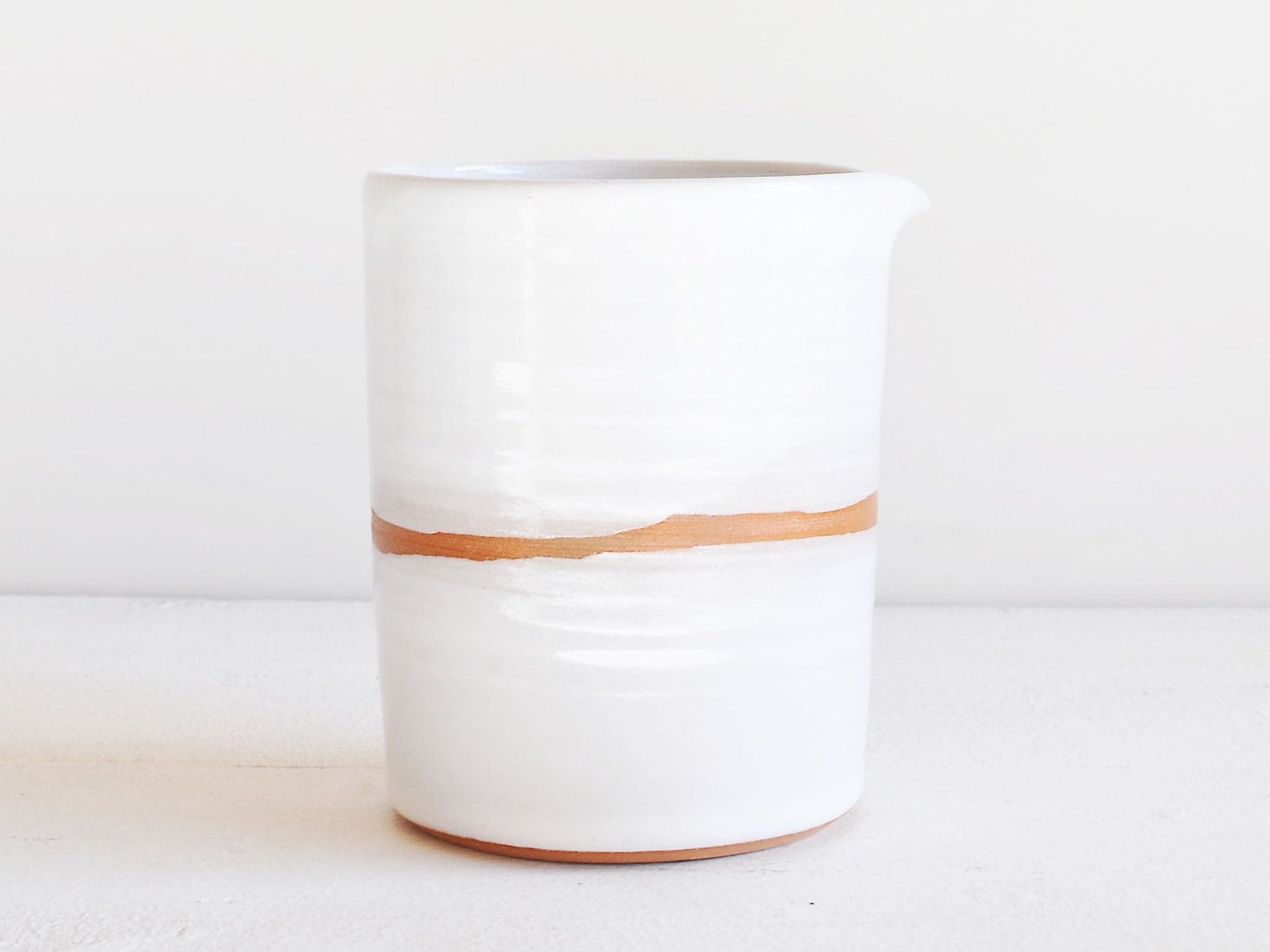 Handmade organic-shaped natural ceramic pitcher