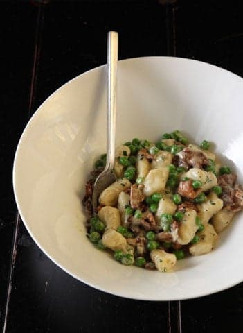 truffled gnocchi with peas and chanterelles