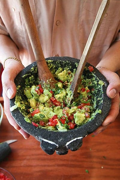 Step 6 Serve immediately, directly from the molcajete (or bowl), with tortilla chips.