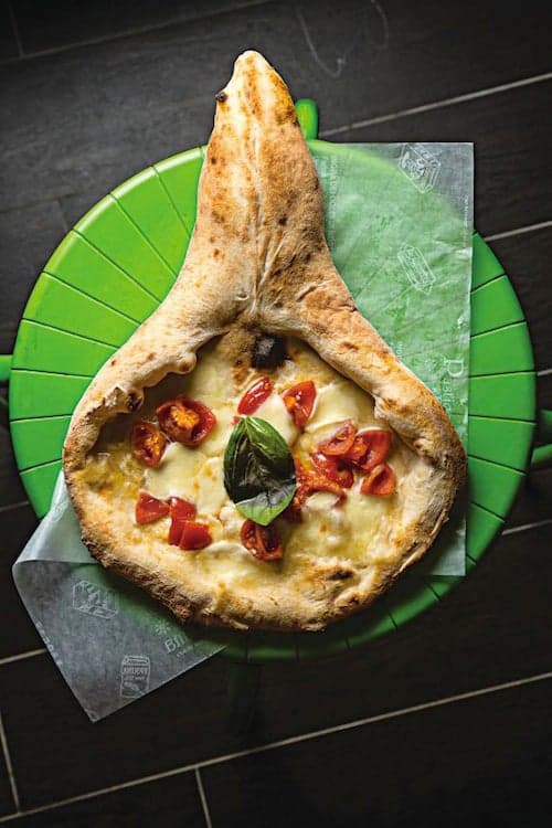 Rachetta (Racket-Shaped Pizza with Mushrooms and Tomatoes)