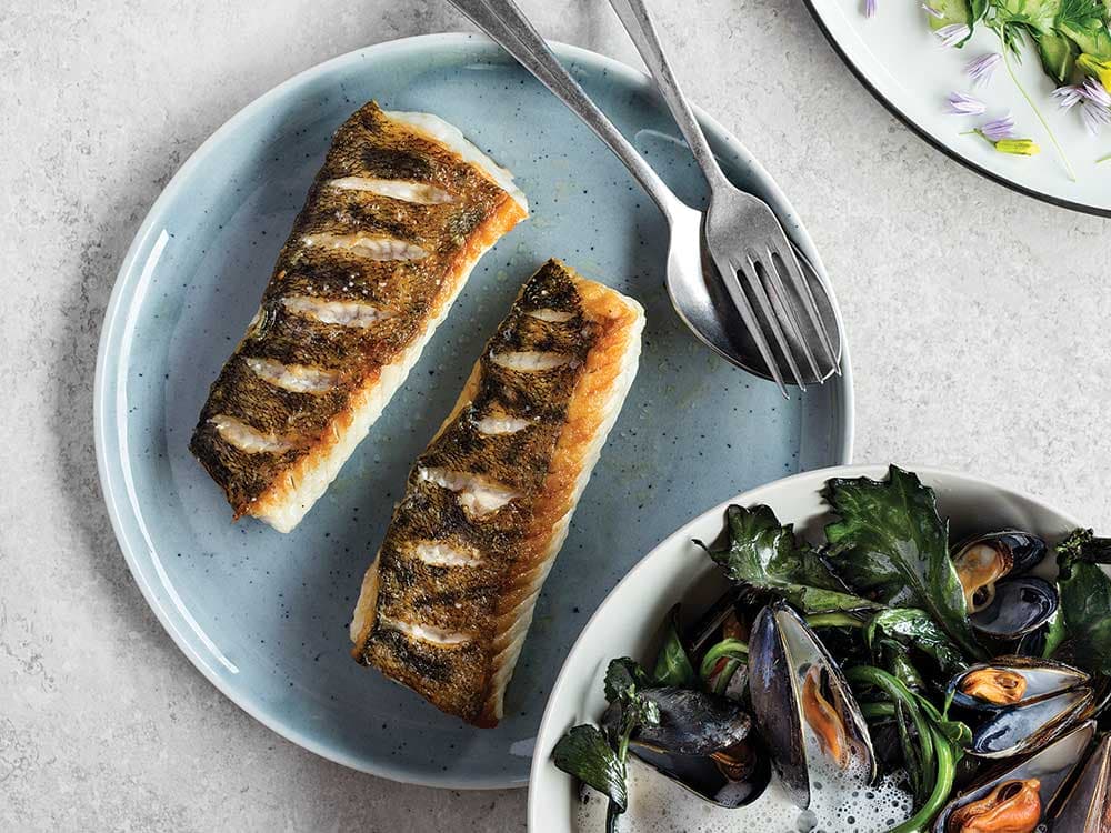 Pan-Seared white Fish  with Mussels, Cabbage  Shoots, and Cream