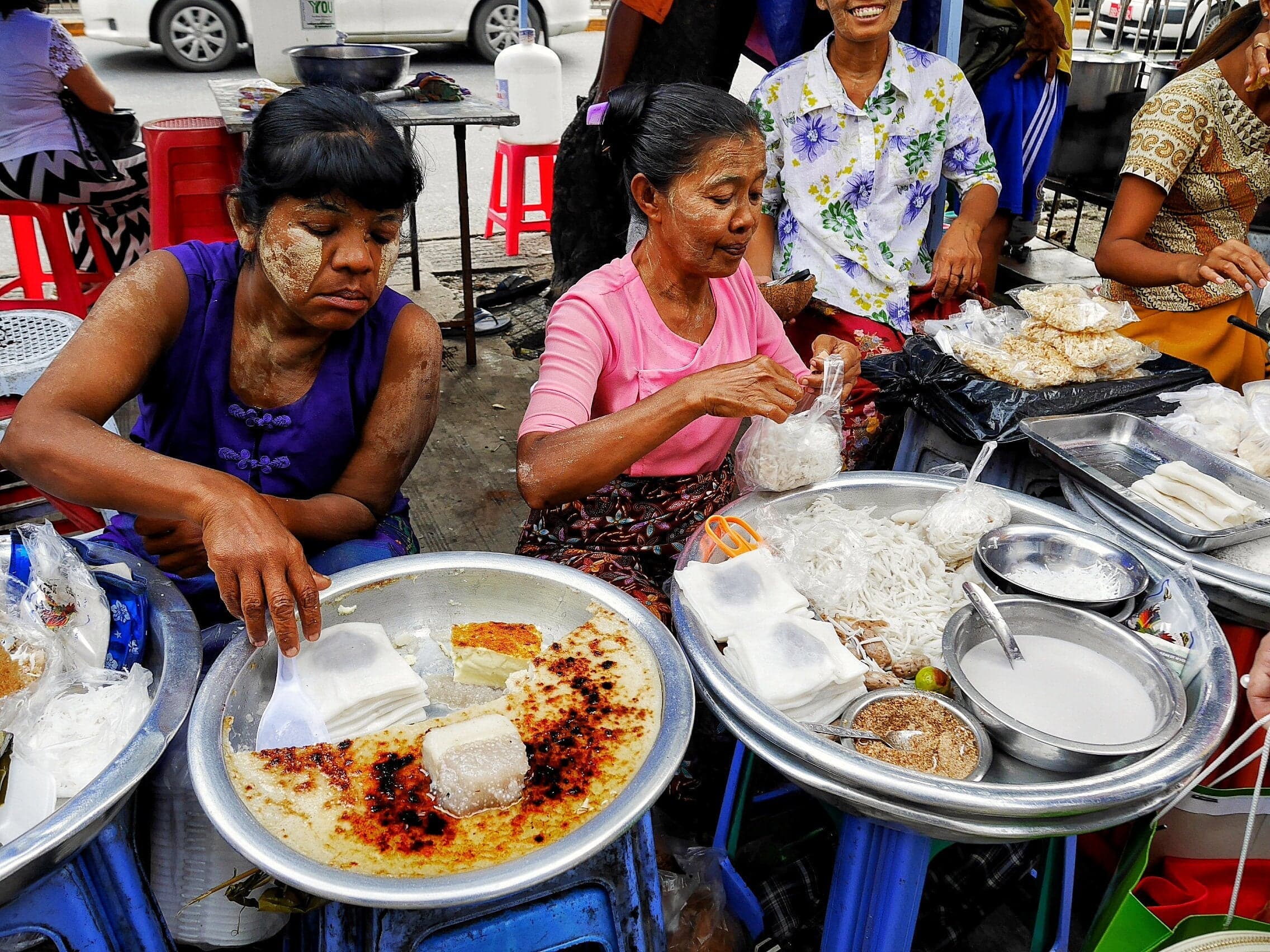 Women selling street food, Burma