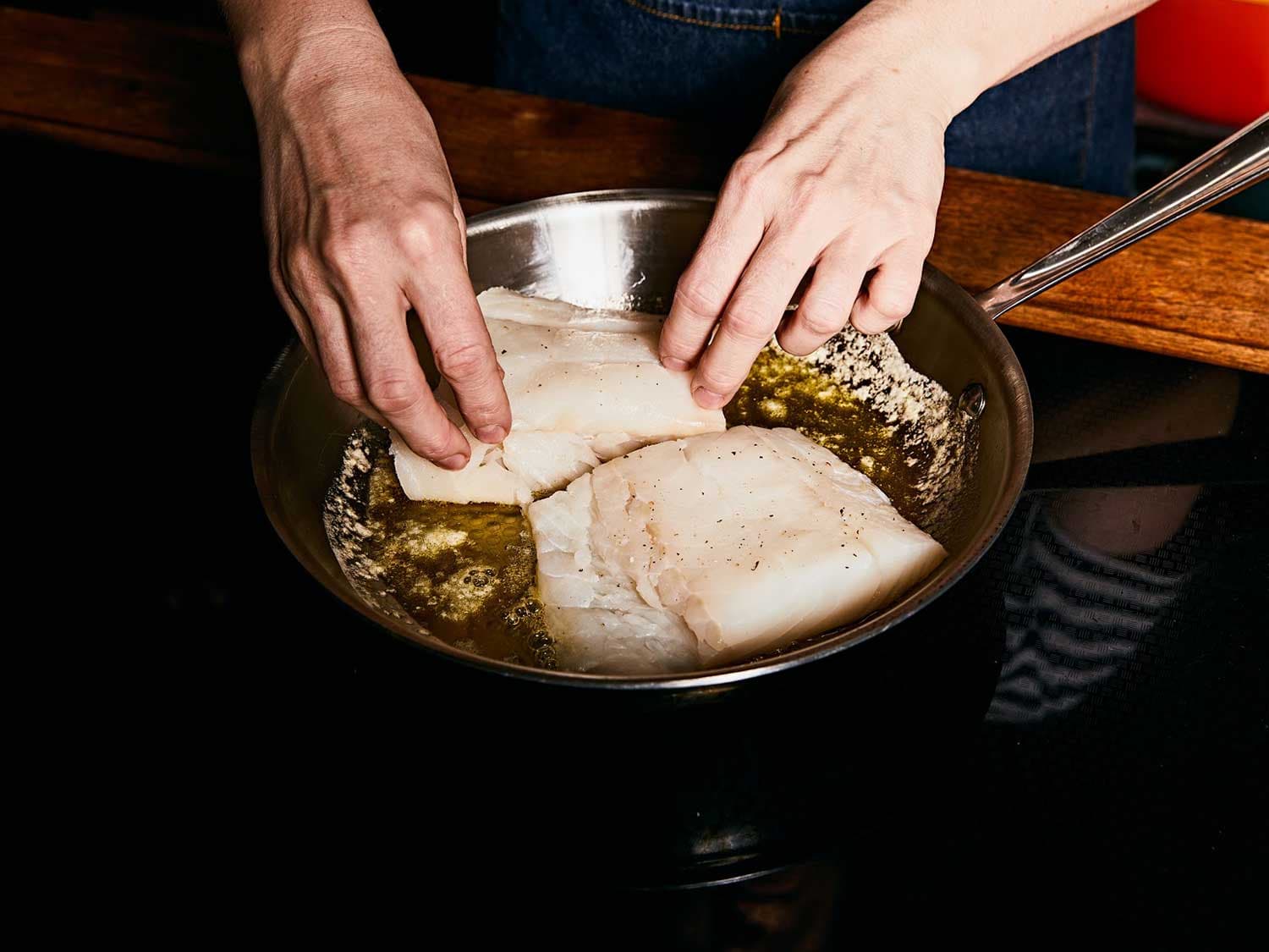 Lightly sear the cod on both sides in a mixture of olive oil and butter.