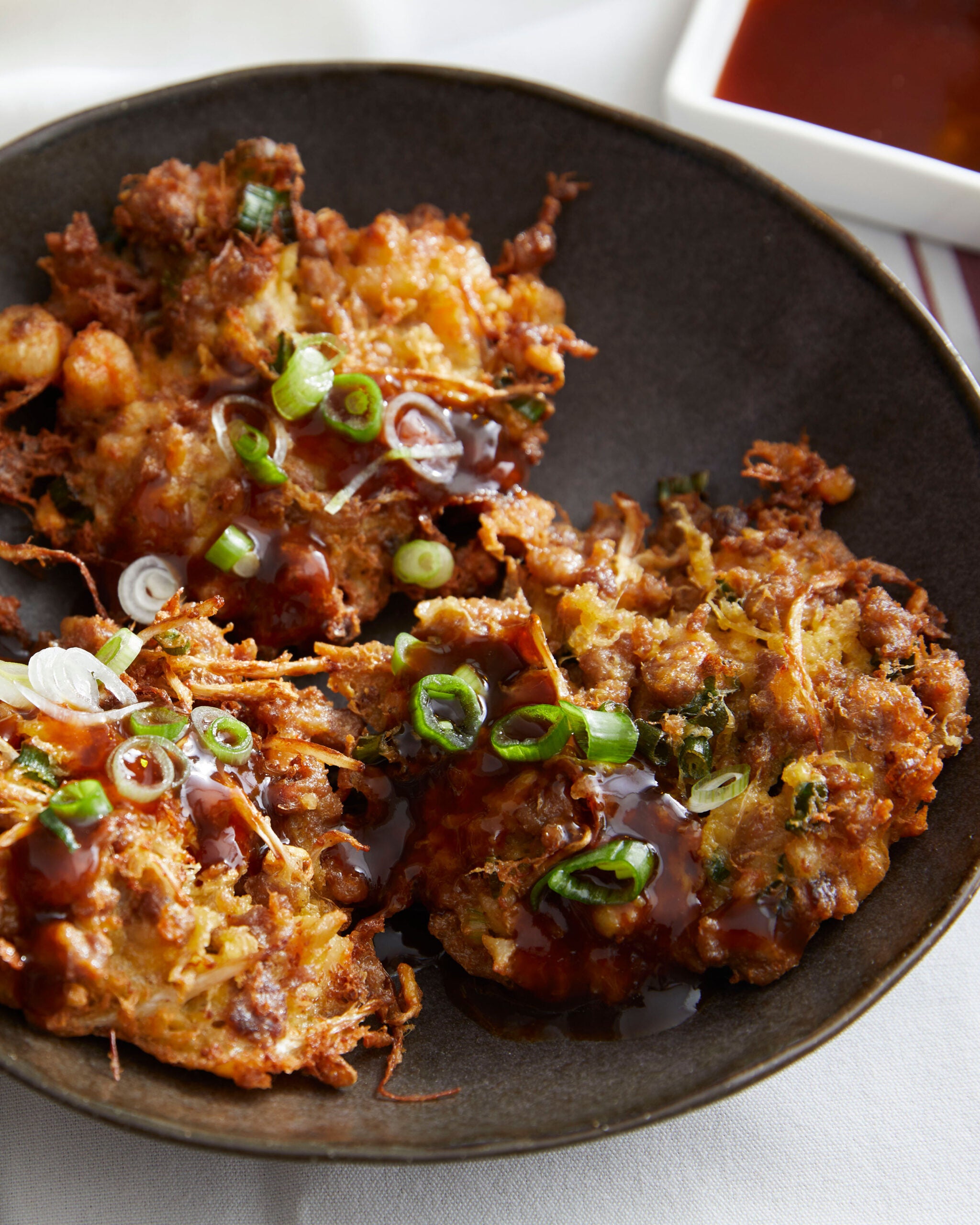 Plate of Egg Foo Young with gravy