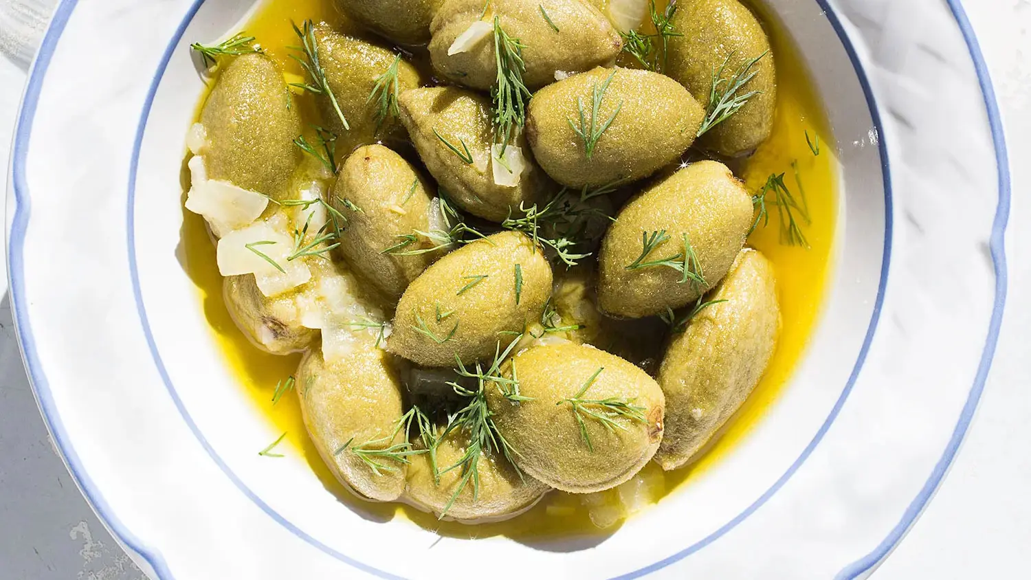 Olive Oil-Poached Green Almonds With Dill-image