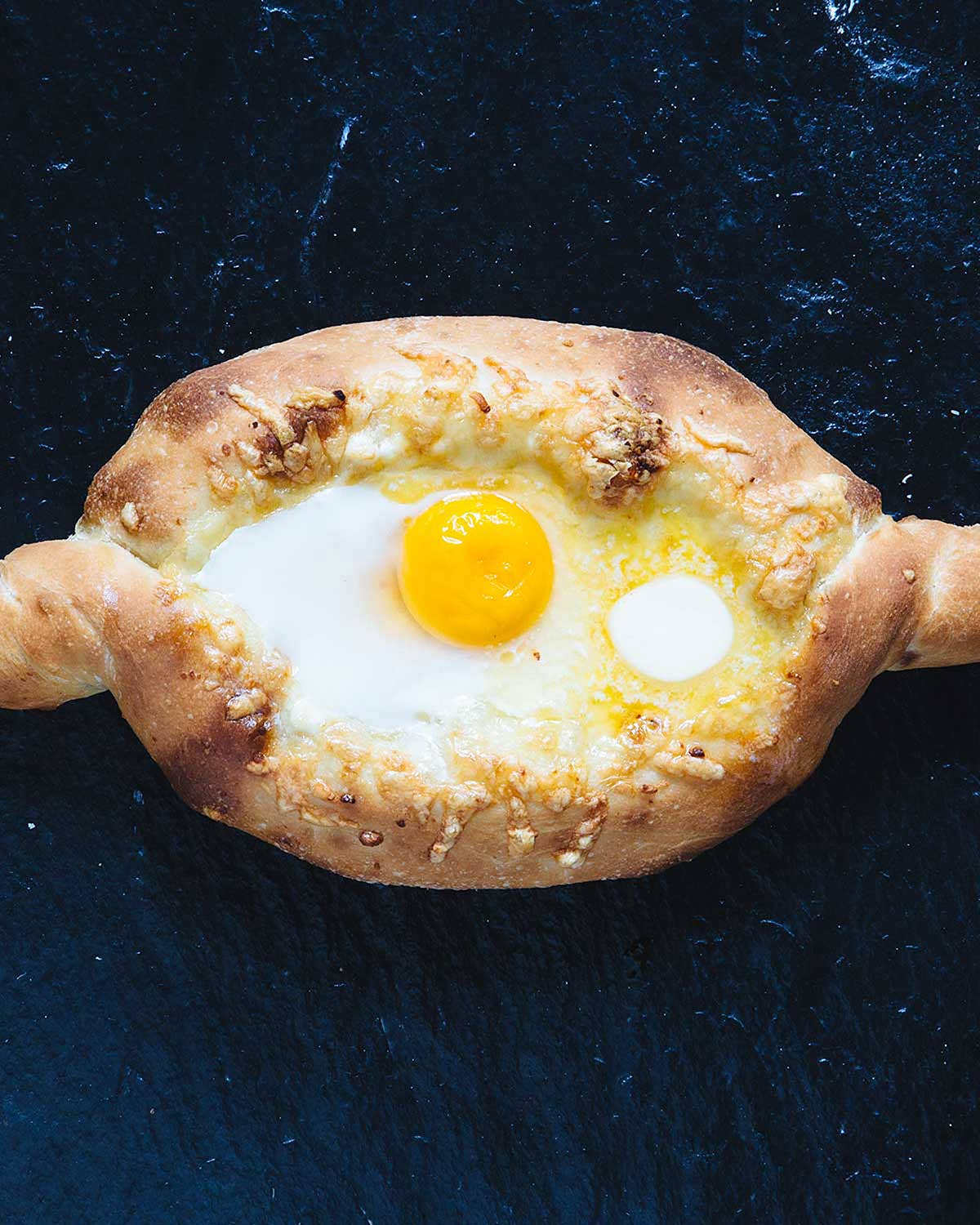 Adjaruli Khachapuri (Georgian Cheese Bread) Adjaruli Khachapuri (Georgian Cheese Bread)