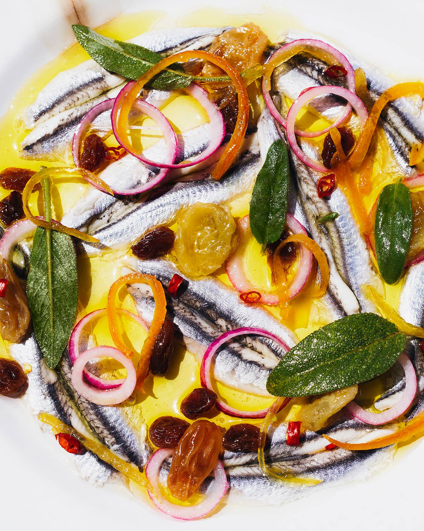 Marinated Anchovies with Candied Citrus, Pickled Raisins, and Chile