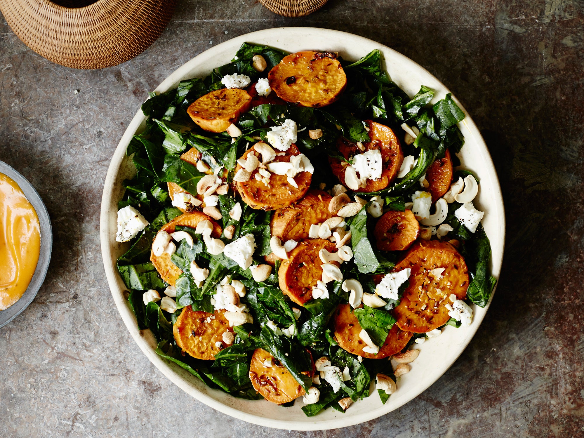 image of Shredded Collard Green Salad With Roasted Sweet Potatoes and Cashews recipe by Saveur