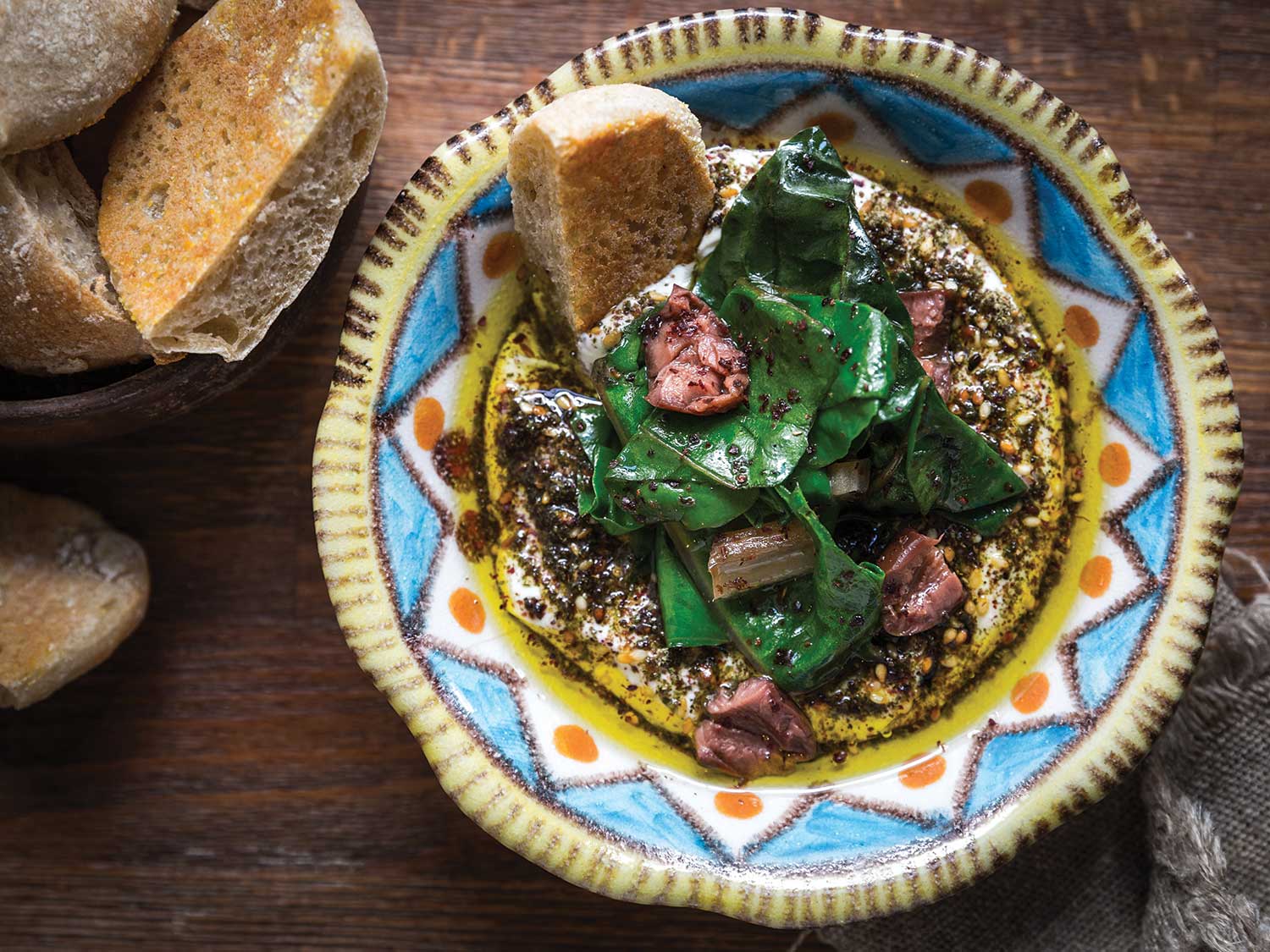 image of Labneh With Swiss Chard, Black Olives, and Za’atar recipe by Saveur