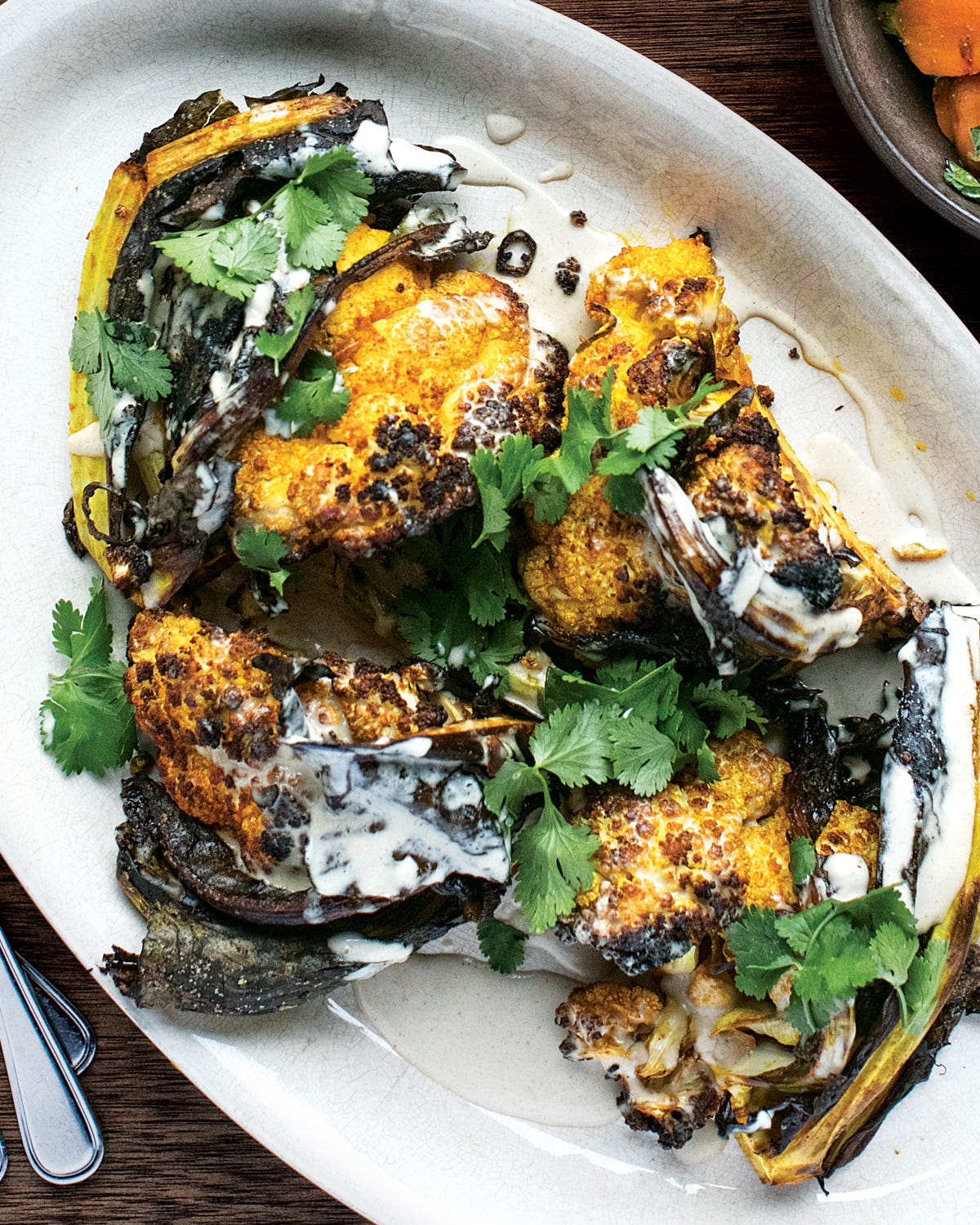 Our Favorite Vegan Recipes to Showcase the Power of Eating Green Spicy Roasted Cauliflower with Tahini
