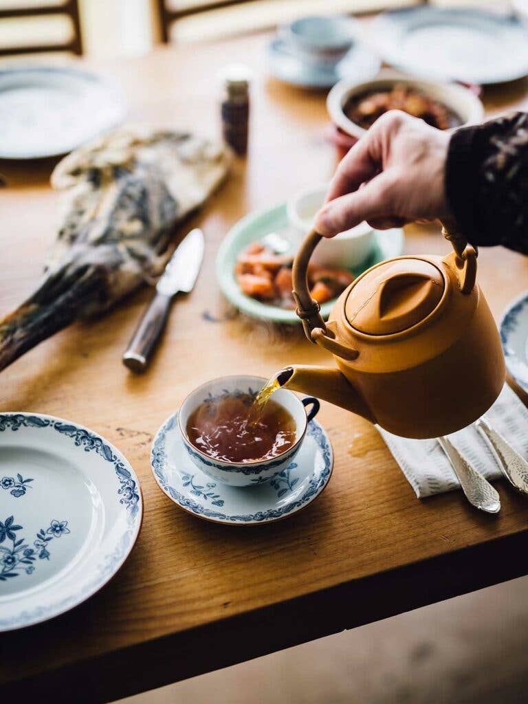 Óli Rubeksen serves tea