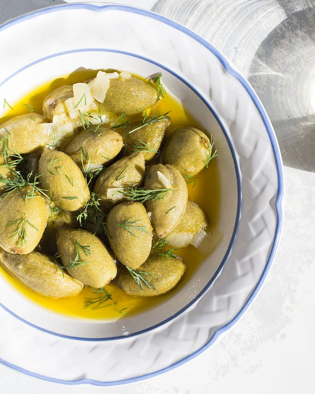 Olive Oil-Poached Green Almonds with Dill