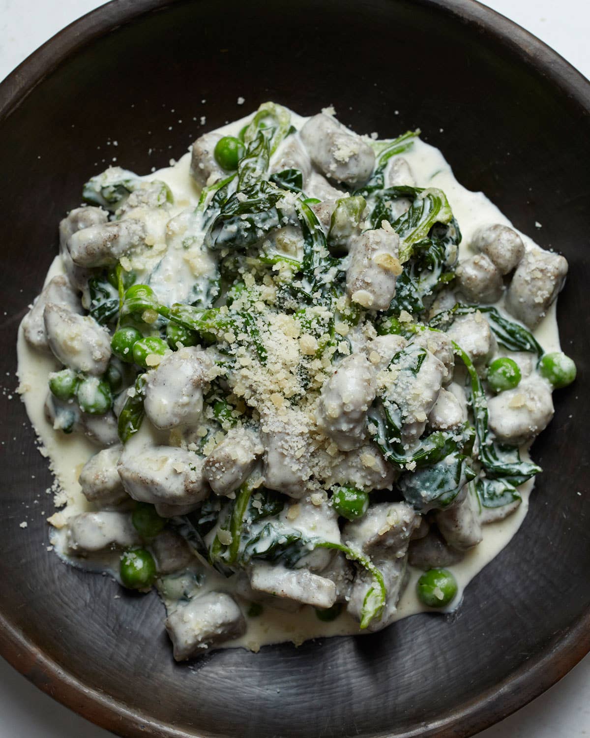 Buckwheat and Ricotta Gnocchi with Cream, Peas, and Spinach