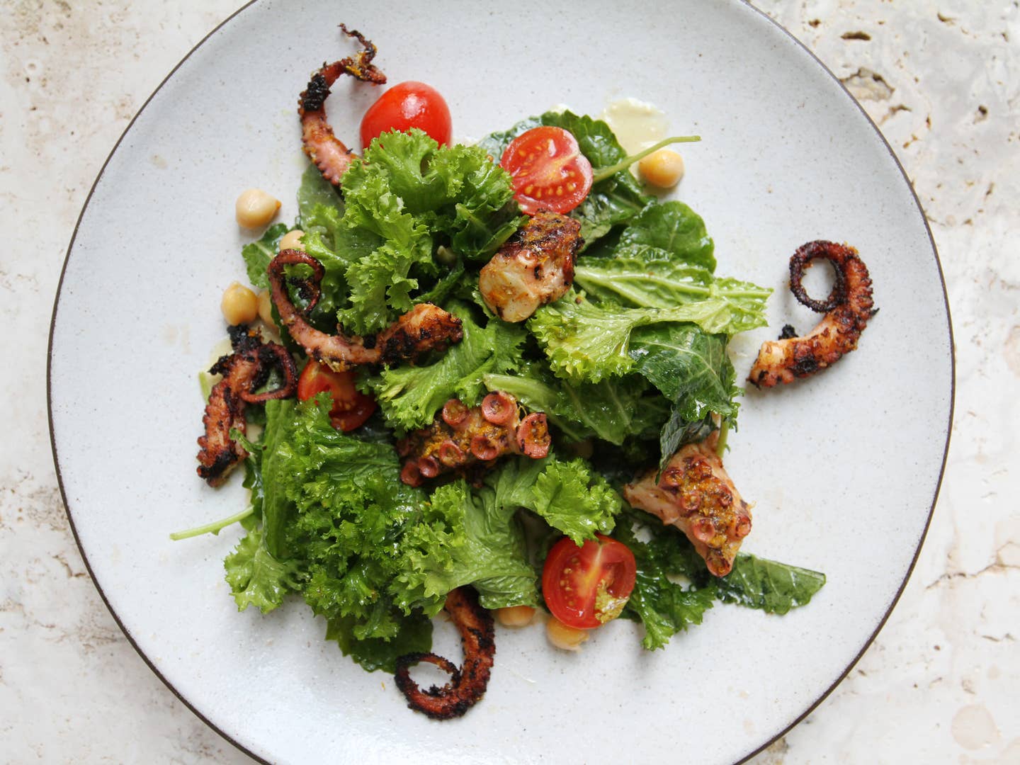 Grilled Octopus with Chickpeas, Cherry Tomatoes, and Anchovy Vinaigrette