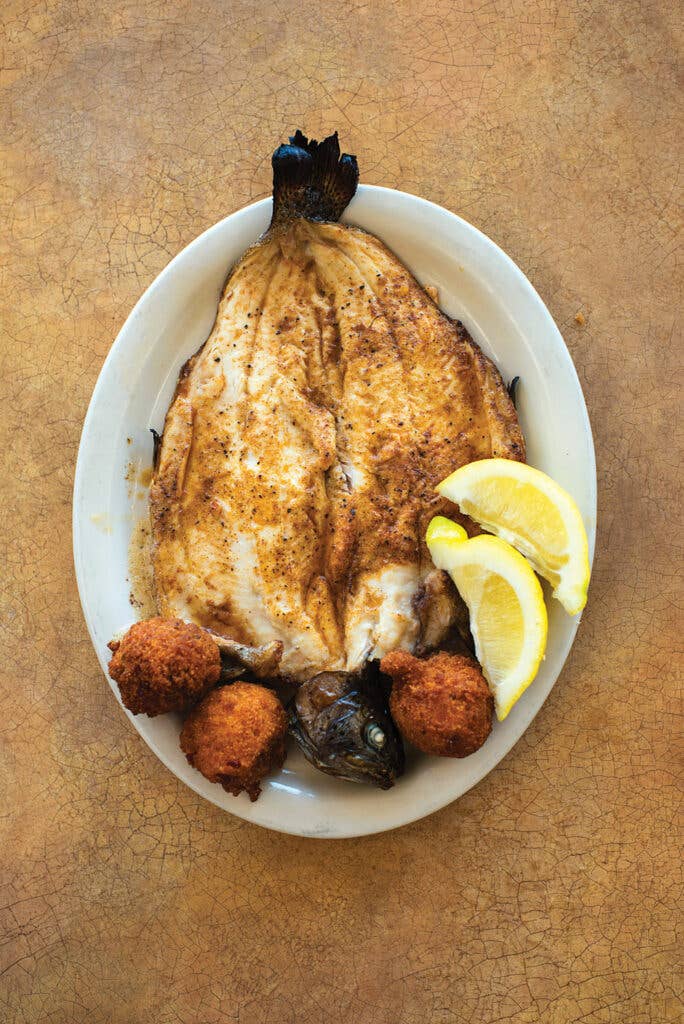 httpswww.saveur.comsitessaveur.comfilesimport2013images2013-077-recieps_broiled-rainbow-trout-with-hush-puppies_1000x1500.jpg