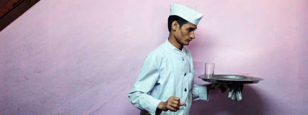 waiter at the Indian Coffee House