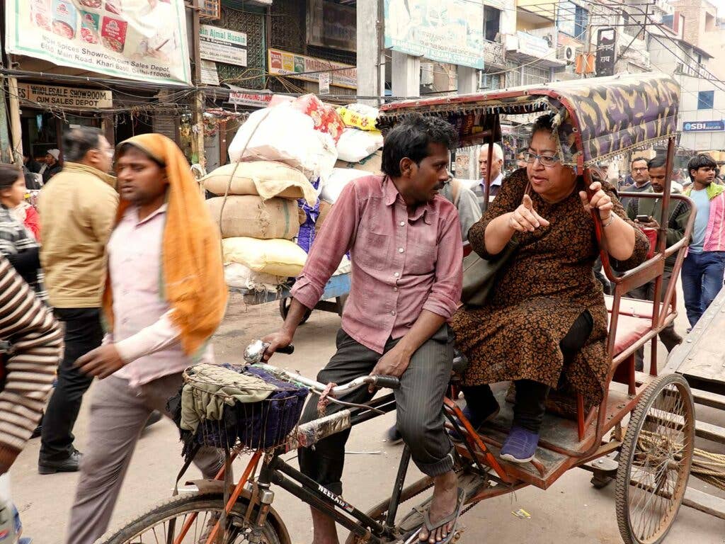 Reshii in a pedal rickshaw