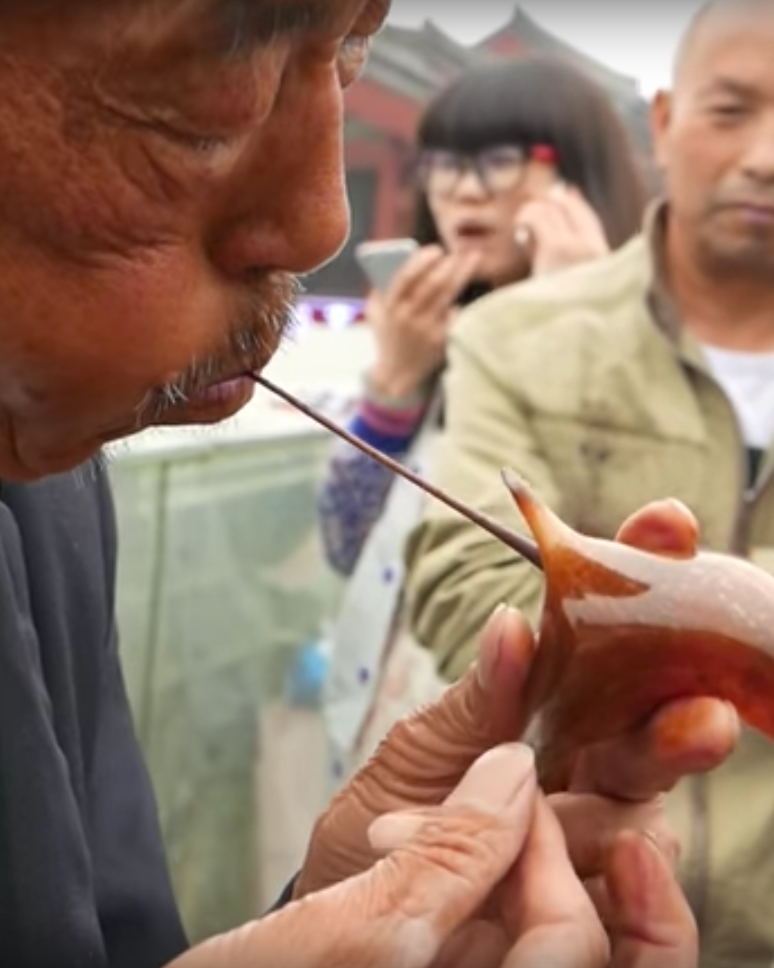 Watch the Amazing Chinese Art of Blowing Molten Sugar Into Glass