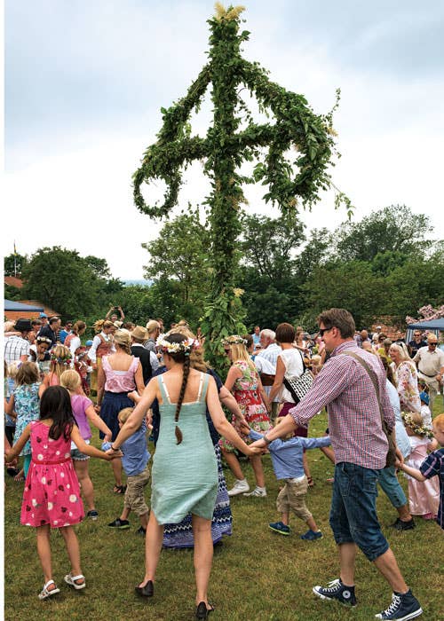 Revelers dance around the majstang in Vickleby, on Oland island, in southern Sweden.