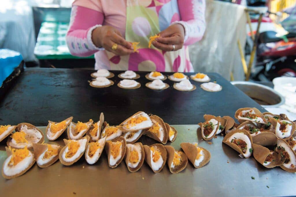 Wafer-thin sweets with egg floss and dried shrimp (khanom bueang)