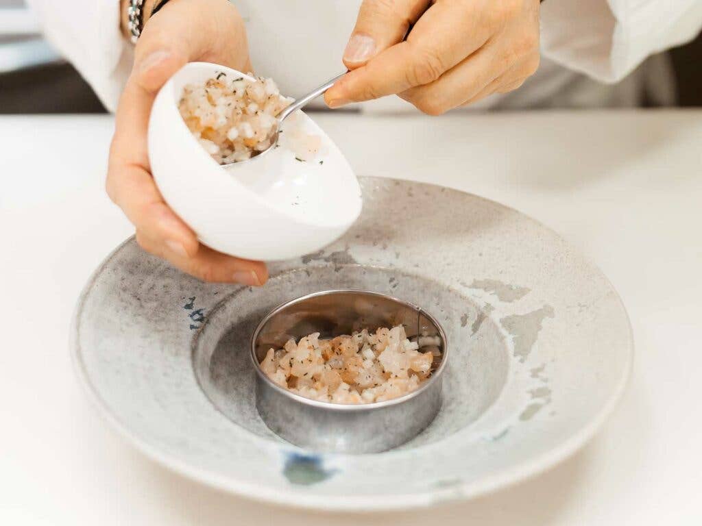 Plating a dish at St. Hubertus