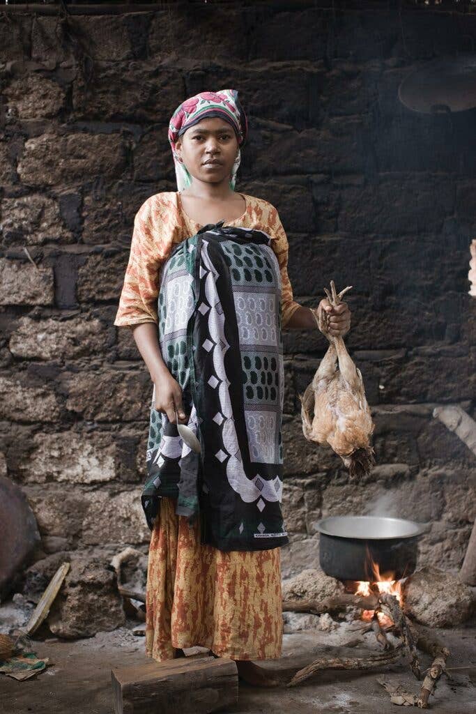 Sauda Holds a Chicken