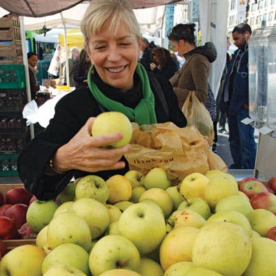 Moulton buys seven Golden Delicious apples, her favorite variety for baking.