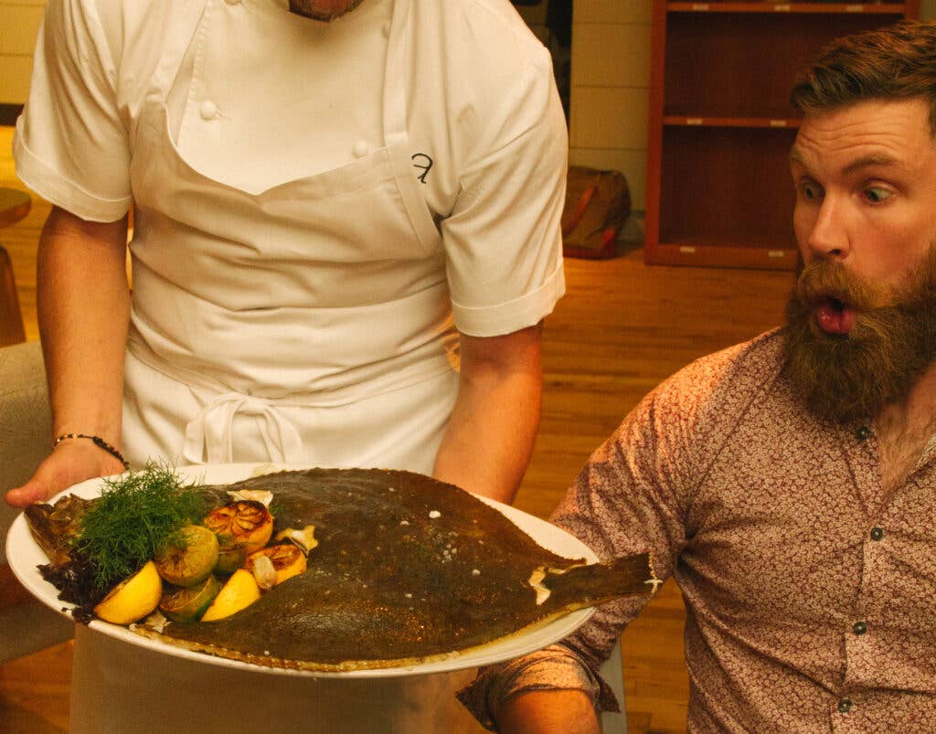 Lafayette Bakery head baker James Belisle reacts to this enormous Atlantic turbot baked in seaweed, capers, and saffron mouselline.