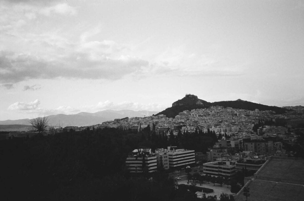 This was my first time climbing up the path behind the Panathenaic Stadium, and I couldn't get enough of the Mount Lycabettus view. Locals jog on a small track on the hill above the stadium, above tou