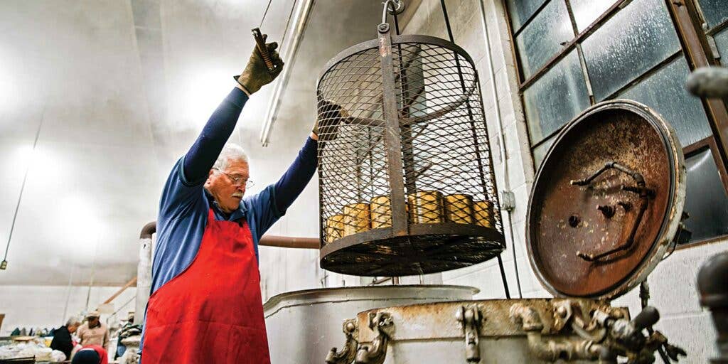 Man preserving at a one of Appalachia's last communal canneries