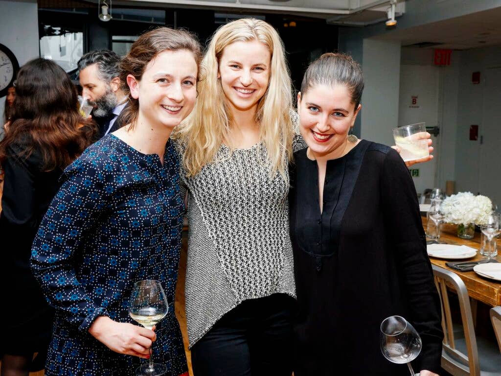 From left, Bonnier Corporation's Molly Battles, Wine Spectator's Jordan McDowell, and NPR's Rose Friedman sip on cocktails and wine before the seated dinner at the SAVEUR Test Kitchen.