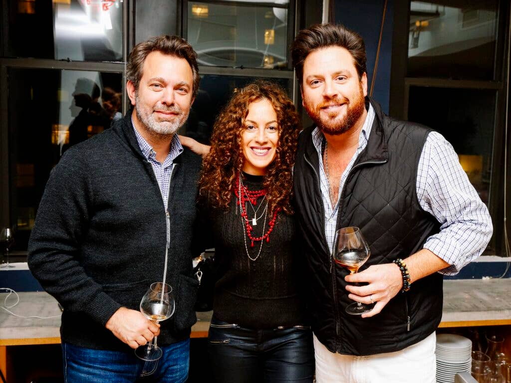 SAVEUR Editor-in-Chief Adam Sachs, My Last Supper photographer Melanie Dunea, and Chef Scott Conant pose for a photo during cocktail hour.