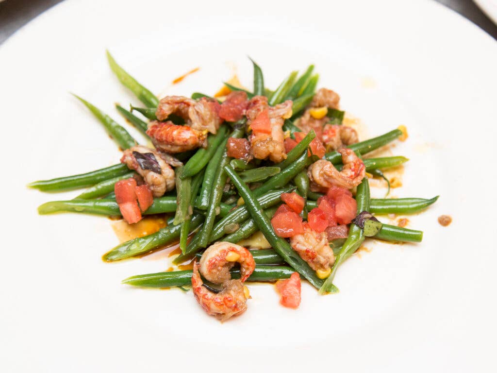 A Haricot Vert salad with Delta crayfish, corn, and opal basil