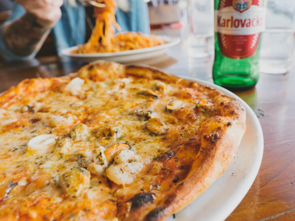 Pizza topped with mussels and squid, Komiza, Croatia
