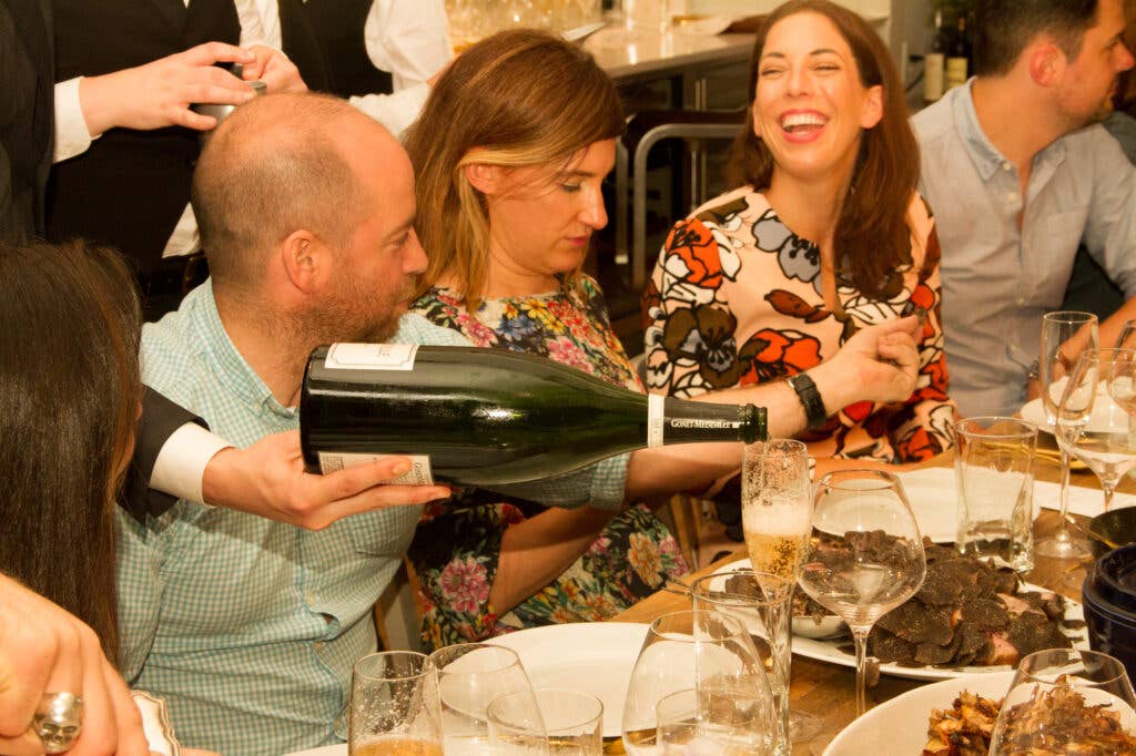The Door's Jesse Gerstein, writer Kate Donnelly, and Buzzfeed's Erin Phraner enjoy one of Atherton's many courses.