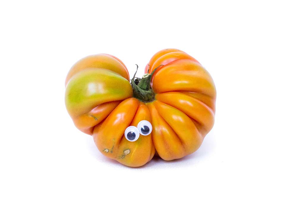 imperfect produce orange tomato