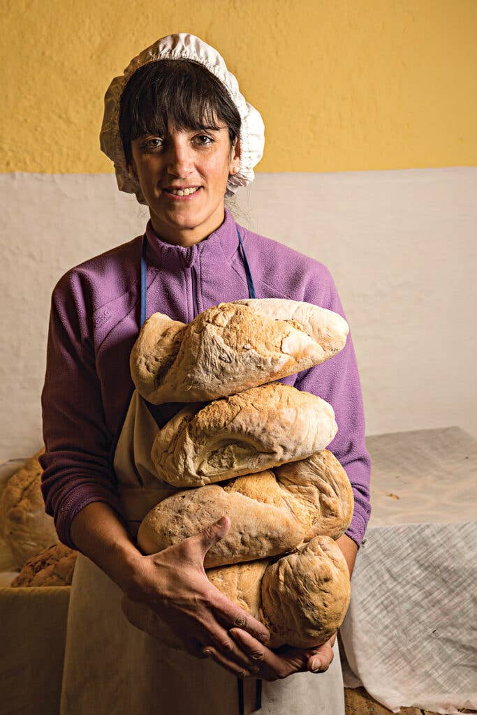 woman holding bread