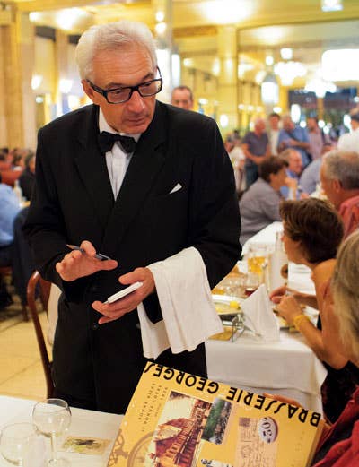 Eric Denis has been a waiter at Brasserie Georges in Lyon for the past 39 years