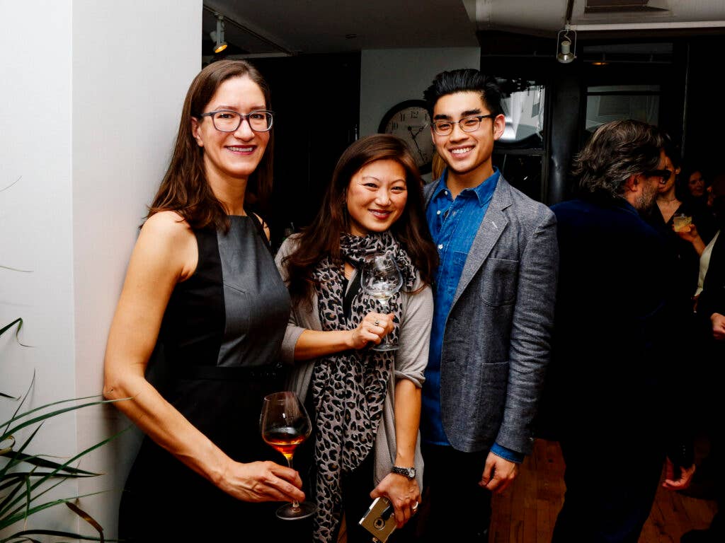 Writer Kathryn Maier, influencer Jean Lee, and SAVEUR Deputy Digital Editor Dan Q. Dao raise a glass to Chef Katie Button.