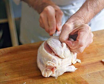 cutting up chicken