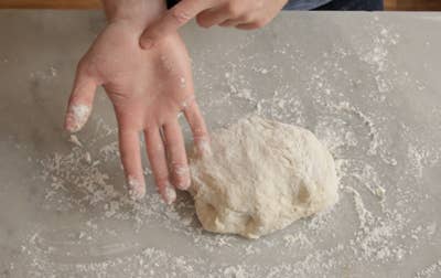 kneading homemade bread dough