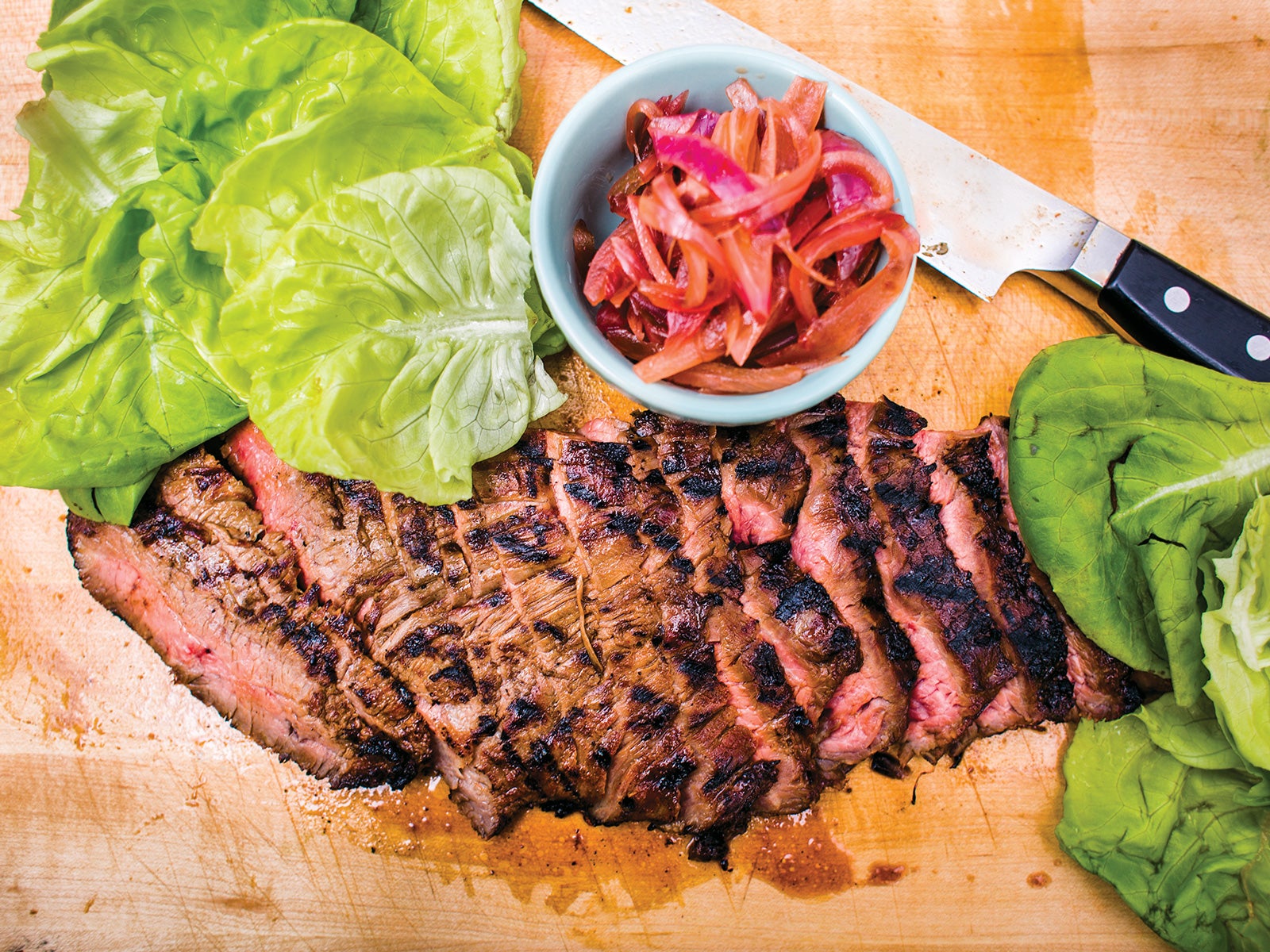 image of Grilled Flank Steak With Coca-Cola-Pickled Onions recipe by Saveur