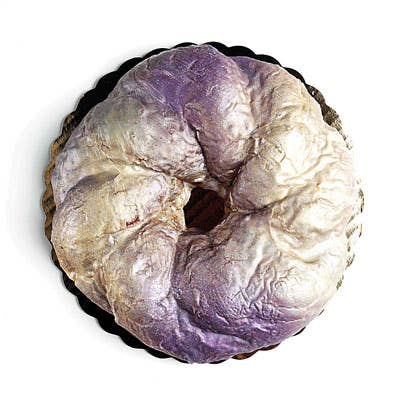 moist, eggy brioche bun, gilded in a thin purple-and-gold glaze