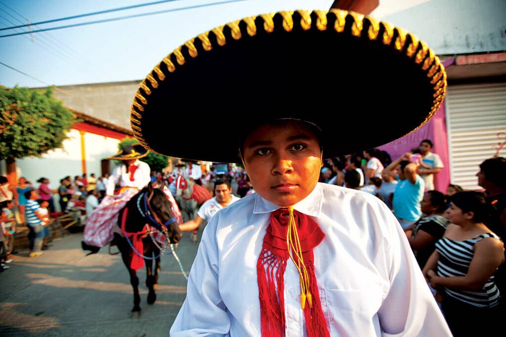 A young participant in a Mexican parade