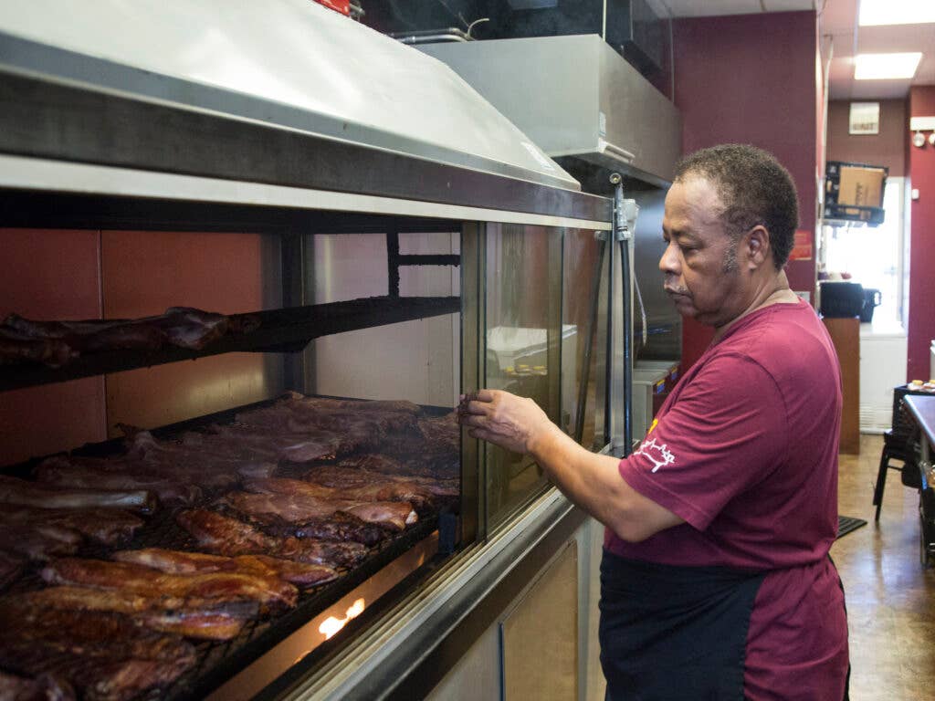 Robert Adams Sr. with his aquarium smoker.