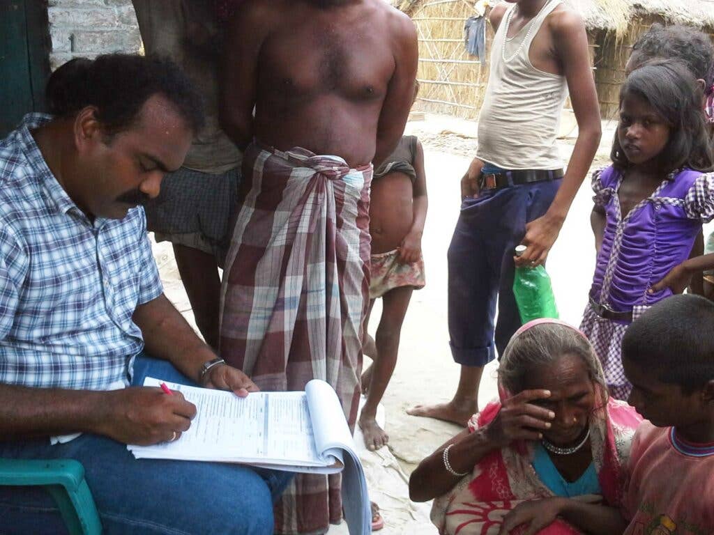 On July 5, 2014, India EIS officer Dr. Somashekar collects data during an investigation of an unexplained acute encephalopathy outbreak affecting young children in Muzaffarpur, Bihar, India.